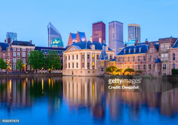 the hague downtown city skyline and parliament buildings at twilight, netherlands - the hague stock pictures, royalty-free photos & images