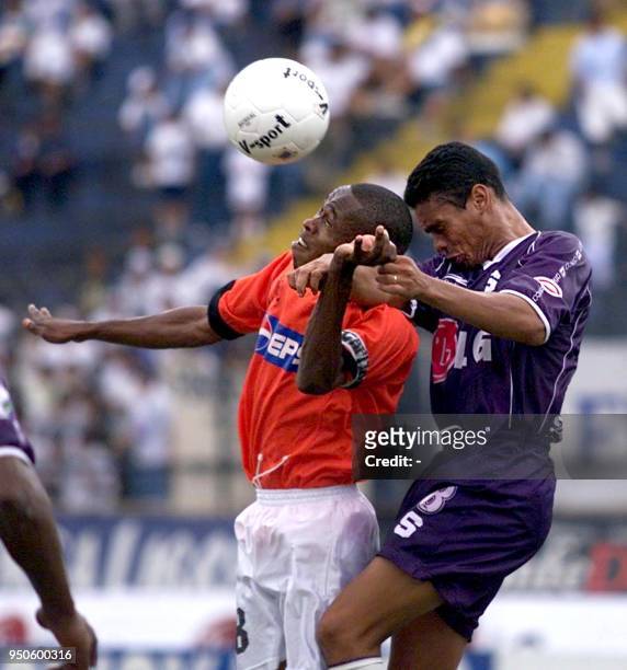 Ubaldo Guardia, of Panama's Tauro , and Jervis Drummand, of the Costa Rican Saprissa , fight for the ball during a game on the Mateo Flores Stadium...