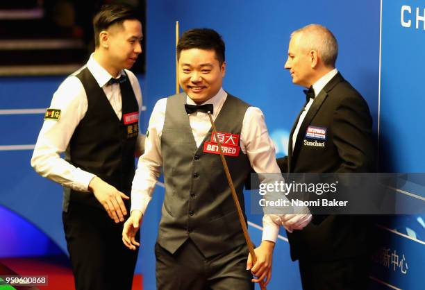 Ding Junhui of China walks off stage after winning his first round match against Xiao Guodong of China of during day four of the World Snooker...