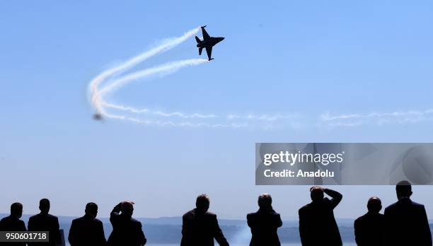 SoloTurk, the F-16 solo aerobatics display team of the Turkish Air Force, performs during a ceremony at Canakkale Martyrs' Memorial in Gallipoli...