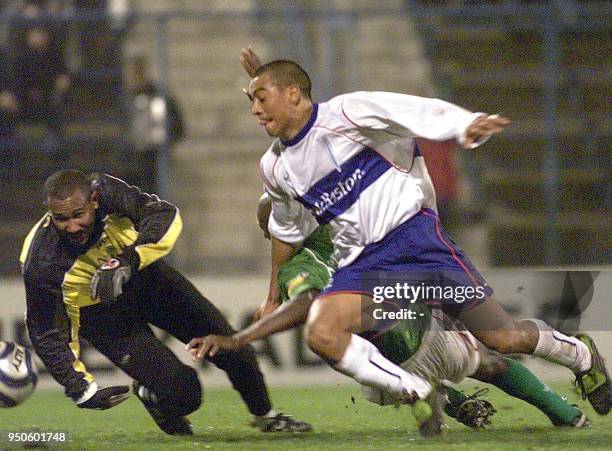 Daniel Perez of the Catholic University is seen scoring his first goal against the colombian team, Once Caldas, during their game in Santiago, Chile,...