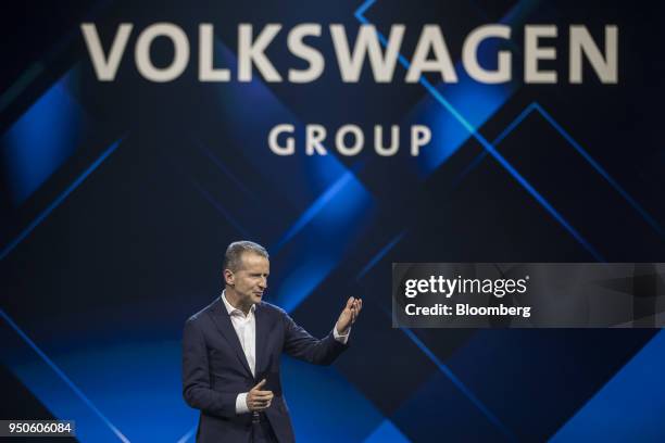 Herbert Diess, chief executive officer of Volkswagen AG , gestures as he speaks at a media event ahead of the Beijing International Automotive...