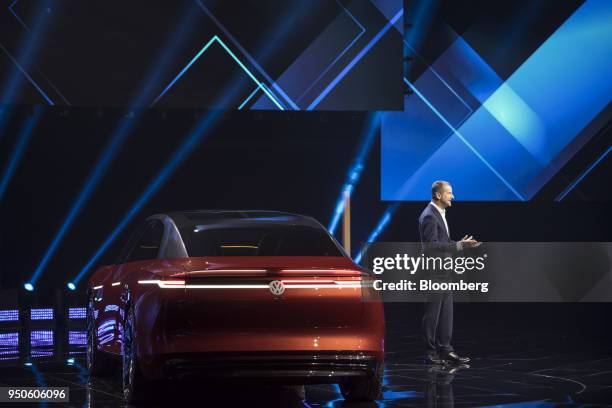 Herbert Diess, chief executive officer of Volkswagen AG , speaks as an electric I.D. Vizzion concept-model limousine stands at a media event ahead of...