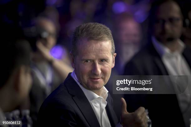 Herbert Diess, chief executive officer of Volkswagen AG , gestures at a media event ahead of the Beijing International Automotive Exhibition, in...