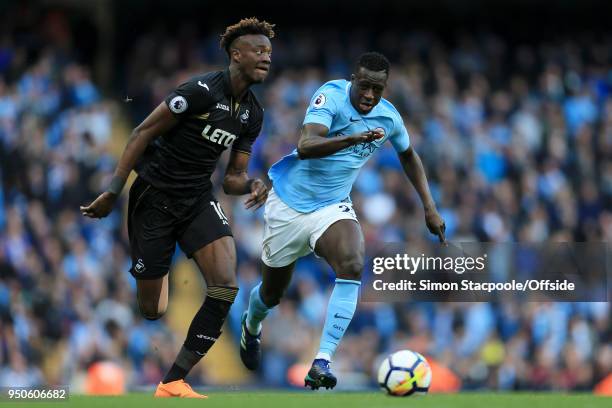 Tammy Abraham of Swansea battles with Benjamin Mendy of Man City during the Premier League match between Manchester City and Swansea City at the...