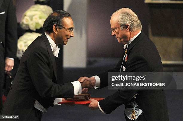 Venkatraman Ramakrishnan receives the Nobel Prize in Chemistry from King Carl XVI Gustaf of Sweden, during the Nobel prize award ceremony at the...