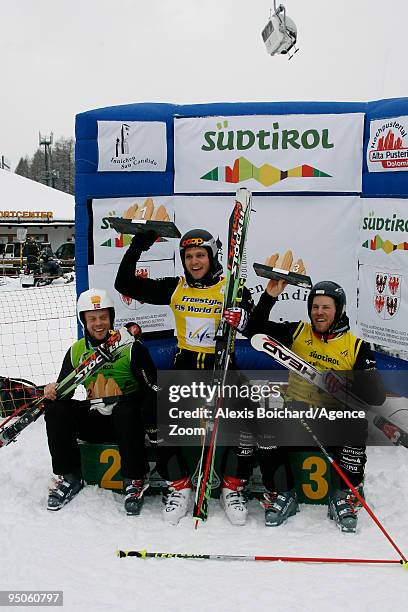 Audun Groenvold of Norway takes 2nd place, Michael Schmid of Switzerland takes 1st place, Conradign Netzer of Switzerland takes 3rd place during the...