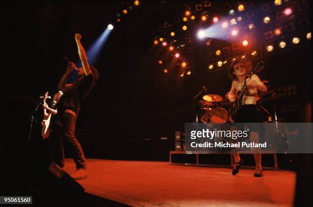 Bassist Malcolm Young, singer Brian Johnson and guitarist Angus Young of heavy rock group AC/DC performing on tour in the UK, 1980. (Photo by Michael...