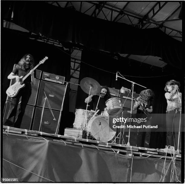 British heavy rock group Black Sabbath performing at the Plumpton festival in Sussex, 8th August 1970. Left to right: bassist Geezer Butler, drummer...