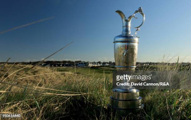 The Claret Jug the Open Championship trophy behind the second green during the media day for the 147th Open Championship on the Championship Course...