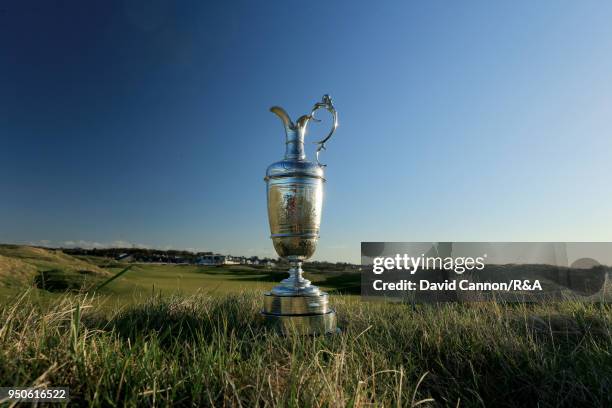 The Claret Jug the Open Championship trophy behind the second green during the media day for the 147th Open Championship on the Championship Course...