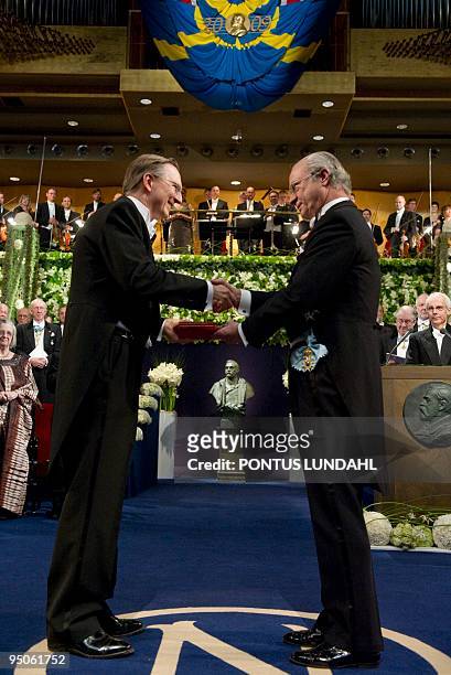 Jack W. Szostak, of Harvard Medical School smiles as he receives the Nobel Prize in Medicine from King Carl XVI Gustaf of Sweden during the Nobel...