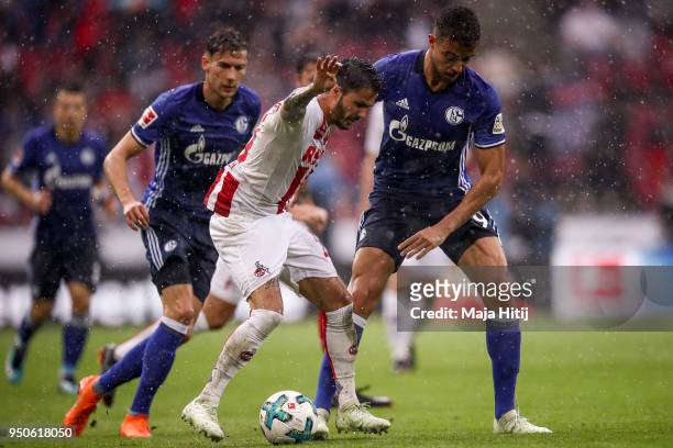 Leon Goretzka of Schalke, Leonardo Bittencourt of 1.FC Koeln and Franco di Santo of Schalke battle for the ball during the Bundesliga match between...
