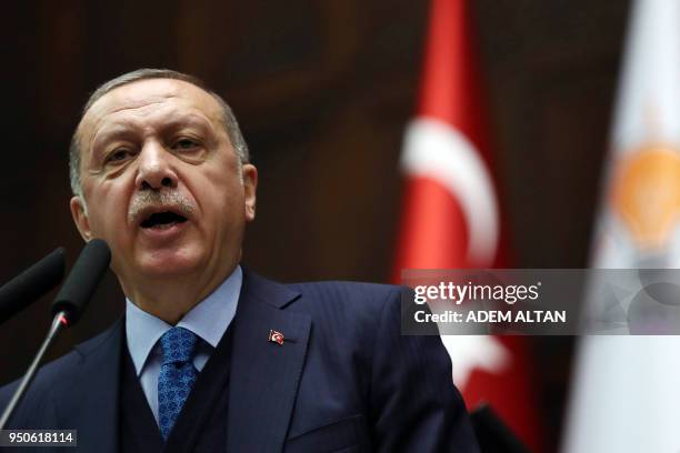 Turkish President and leader of the Justice and Development Party Recep Tayyip Erdogan gestures as he delivers a speech during the AK Party's...