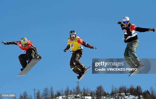 Norway's Stian Sivertzen jumps to place second in the overall standing next to Mattias Blomberg of Sweden and Poland's Mateusz Ligocki during the...
