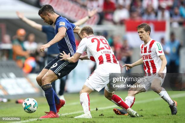 Franco di Santo of Schalke and Tim Handwerker of 1.FC Koeln battle for the ball during the Bundesliga match between 1. FC Koeln and FC Schalke 04 at...