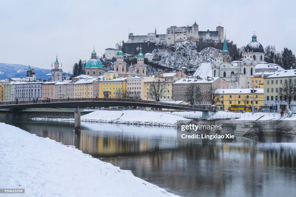 Hohensalzburg Castle and Salzburg old town reflected in Salzach River, Salzburg, Austria