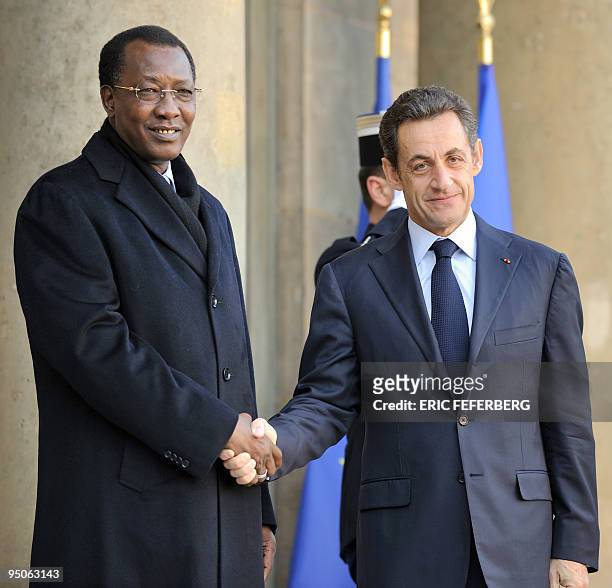 France's President Nicolas Sarkozy welcomes his Chad Republic's counterpart Idriss Deby prior to a lunch at the Elysee palace in Paris on December...