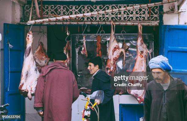 market in essaouira - djellaba stock pictures, royalty-free photos & images