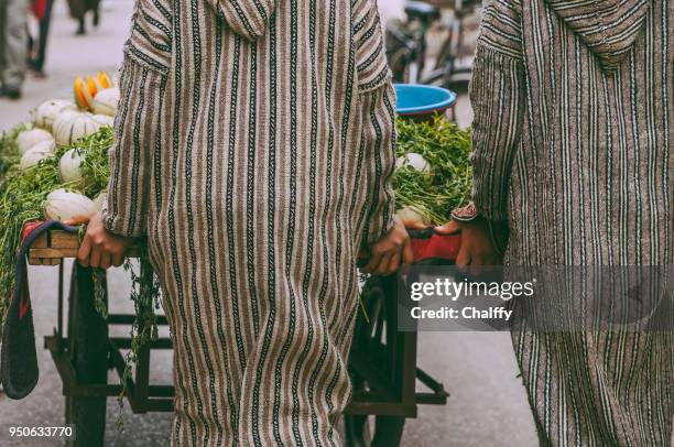 fruits and vegetables market in essaouira - djellaba stock pictures, royalty-free photos & images