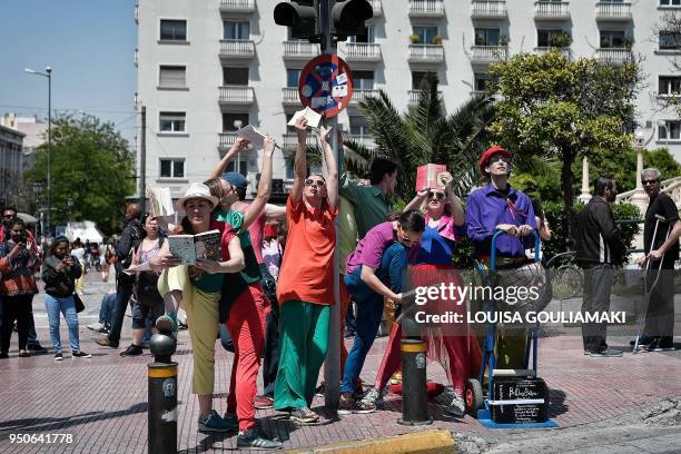 Group of dancers perform "pop-up readings" show at a traffic light in central Athens, on April 24, 2018 in order to promote the "Athens 2018 - World...