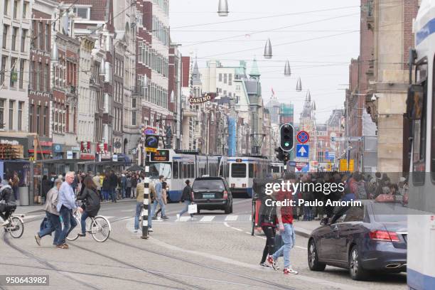 people at the downtown amsterdam,netherlands - amsterdam business stock pictures, royalty-free photos & images