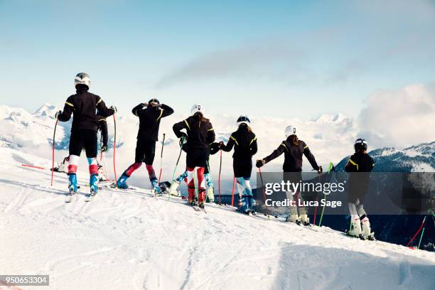 a group of teenagers at ski school race training in verbier, switzerland - alpine skiing stockfoto's en -beelden