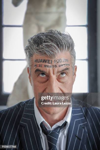 Italian artist Maurizio Cattelan poses for a photo during the ceremony where he is given title of Honorary Professor of sculpture at the Accademia...