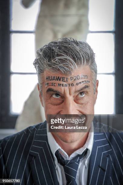 Italian artist Maurizio Cattelan poses for a photo during the ceremony where he is given title of Honorary Professor of sculpture at the Accademia...