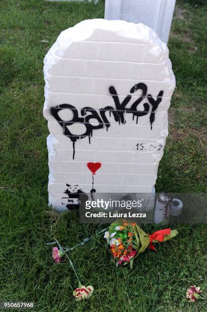 The gravestone of artist Banksy from the art installation Eternity is displayed after the ceremony where Italian artist Maurizio Cattelan is given...