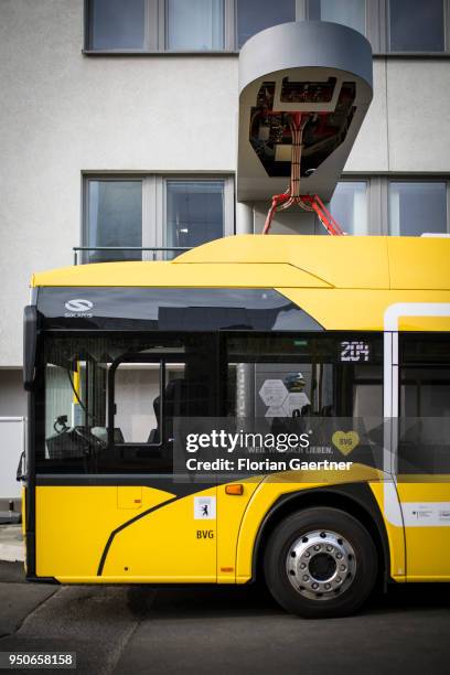 An electric bus is pictured during the charge process on April 24, 2018 in Berlin, Germany.