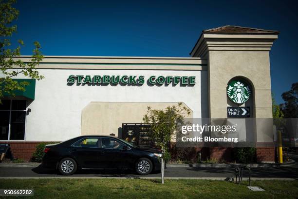 Customer enters the drive-thru lane at a Starbucks Corp. Coffee shop in Rodeo, California, U.S., on Monday, April 23, 2018. The world's largest...