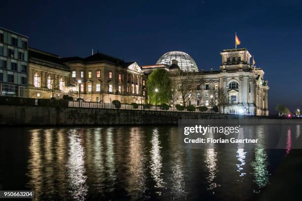 The Reichstag building is pictured during blue hour on April 19, 2018 in Berlin, Germany.