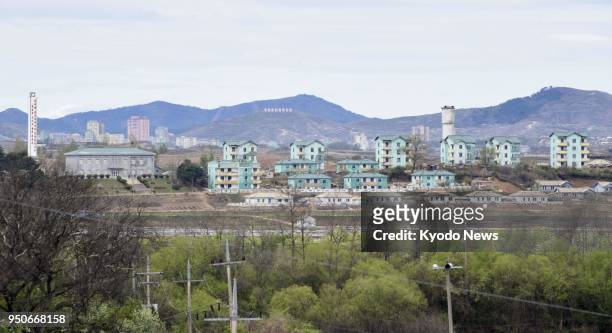 Photo shows an uninhabited North Korean village as seen from Daeseong-dong, a village in the demilitarized zone in northern South Korea, on April 24,...