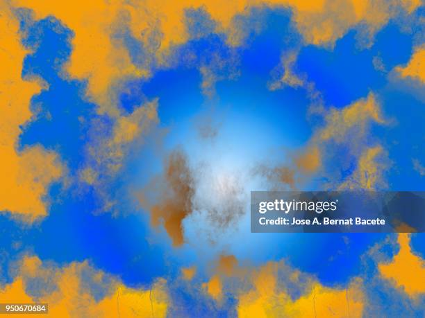 full frame of forms and textures of an explosion of powder and smoke of color yellow and ochre on a light blue background. - yellow light effect stock pictures, royalty-free photos & images