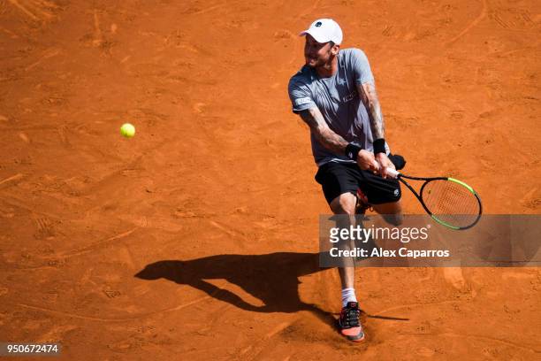 Andreas Haider-Maurer of Austria plays a backhand against Roberto Carballes Baena of Spain in their match during day three of the Barcelona Open Banc...