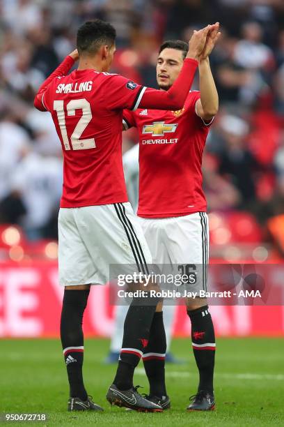 Chris Smalling of Manchester United and Matteo Darmian of Manchester United celebrate at full time during The Emirates FA Cup Semi Final match...