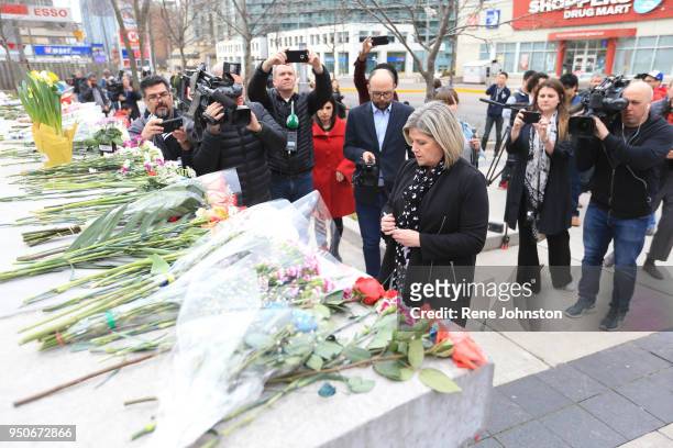 Leader Andrea Horwath pauses at the memorial to give condolences to the dead from the van attack. A van mounted the curb and struck pedestrians...