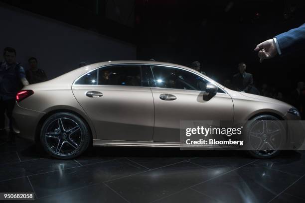 Attendees inspect a new Mercedes-Benz A-Class L Sport sedan during a premiere event in Beijing, China, on Tuesday, April 24, 2018. In the past couple...
