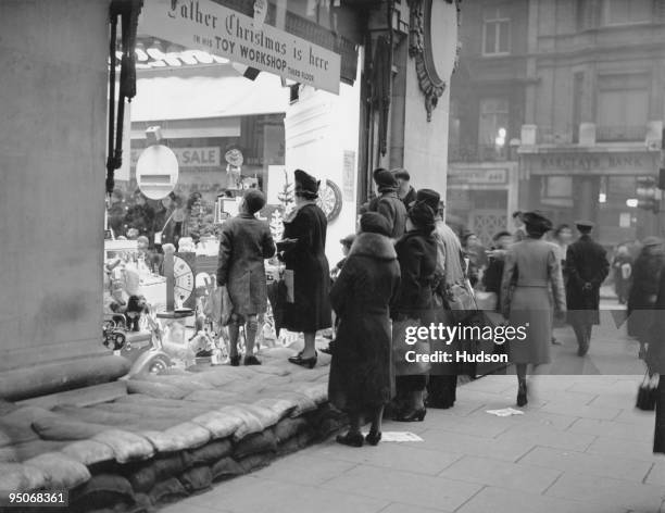 Sandbags protect a shop window at Selfridges in London, during the first Christmas of World War II, 16th December 1939.