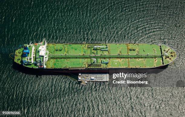 The Alaskan Frontier oil tanker takes on fuel at an outside anchorage in this aerial photograph taken near the Port of Los Angeles in Los Angeles,...