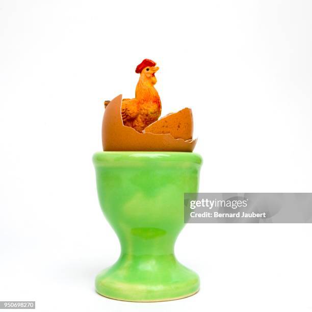 symbol picture, easter, concept egg and egg cup, studio shot - bernard jaubert stock pictures, royalty-free photos & images