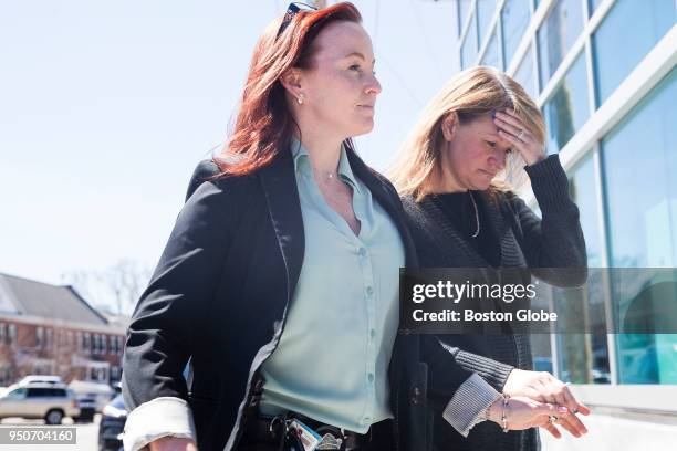 Denise Ezekiel, right, a former payroll director for the Massachusetts State Police who is alleged to have stolen nearly $24,000 from the department,...