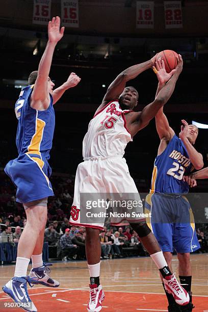 Dele Coker of St. John's Red Storm attempts a shot against Hofstra Pride at Madison Square Garden on December 20, 2009 in New York, New York.