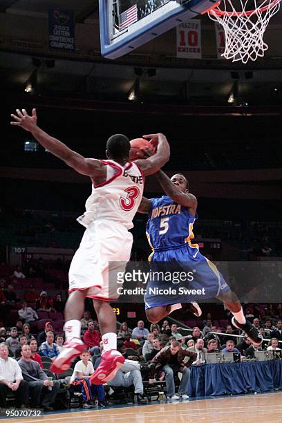 Malik Boothe of St. John's Red Storm blocks a shot against Chaz Williams of Hofstra Pride blocks at Madison Square Garden on December 20, 2009 in New...