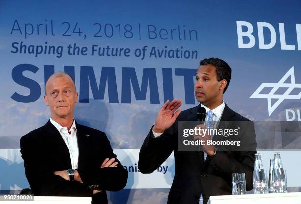 Tom Enders, chief executive officer of Airbus SE, left, pauses as Bertrand-Marc Allen, president of Boeing Co., speaks during a panel discussion at...