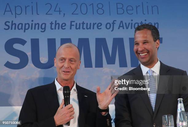 Tom Enders, chief executive officer of Airbus SE, left, speaks as Bertrand-Marc Allen, president of Boeing Co., reacts at the Berlin Aviation Summit...