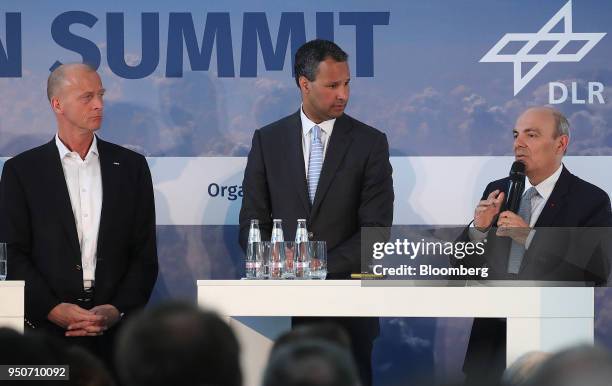 Eric Trappier, chief executive officer of Dassault Aviation SA, left, speaks during a panel discussion with Tom Enders, chief executive officer of...