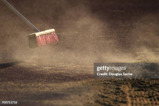 cloud of dust from the cleaning push broom - sweeping landscape stock pictures, royalty-free photos & images