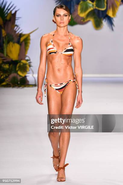 Model walks the runway at the Agua de Coco fashion show during the SPFW N45 Spring Summer 2019 on April 21, 2018 in Sao Paulo, Brazil.